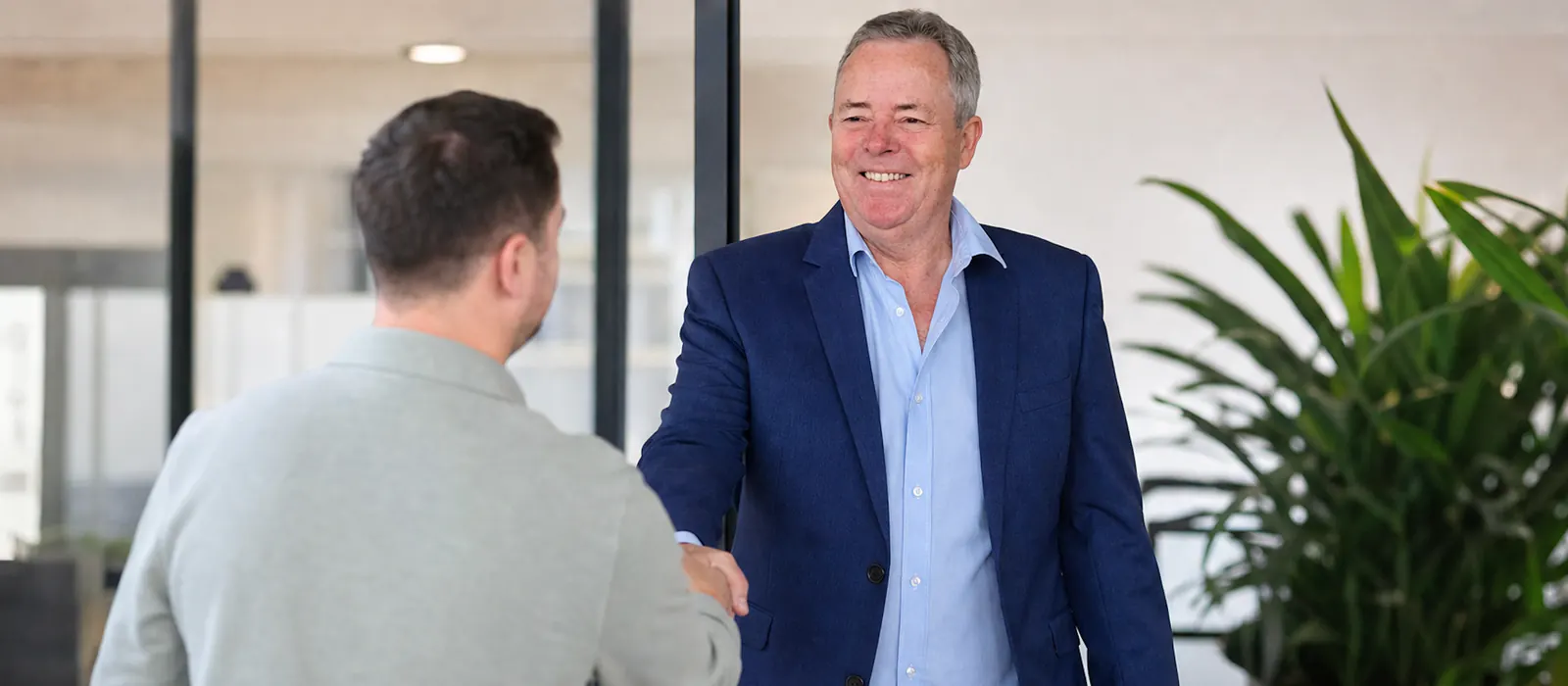 Paul Hillary greeting a client at the Coast 2 Coast Property Finance office